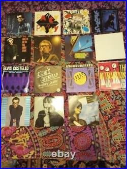 17 ELVIS COSTELLO 45's with picture sIeeves! Most of them Imports